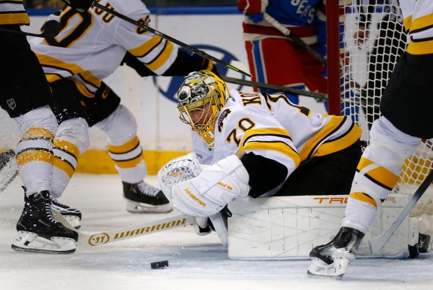 Boston Bruins goalie Joonas Korpisalo (70) prepares to cover the puck during the first period of an NHL game against the New York Rangers Monday, Jan. 26, 2026, in New York. (AP Photo/John Munson)