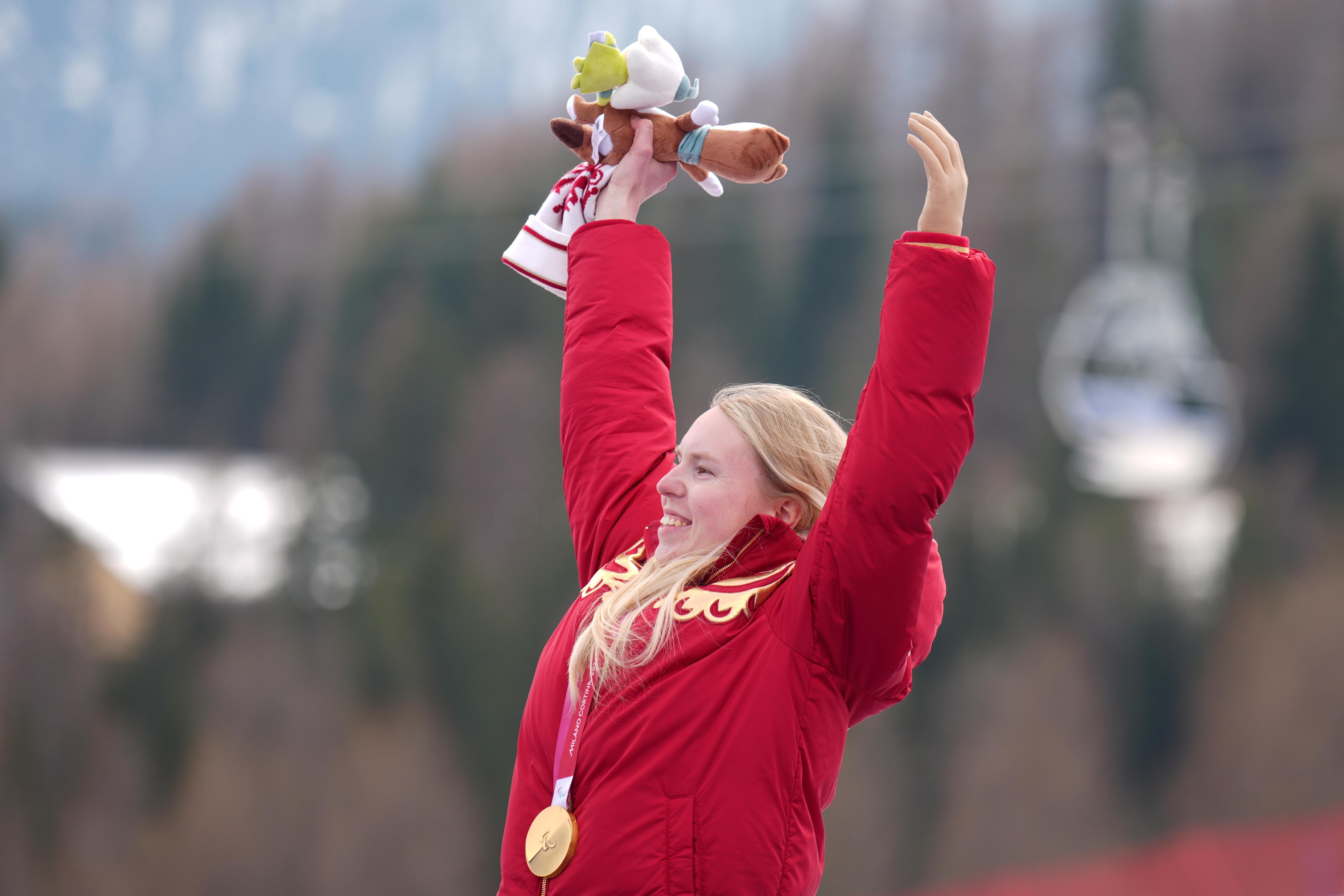 Varvara Voronchikhina, of Russia, smiles on the podium after winning a gold medal.