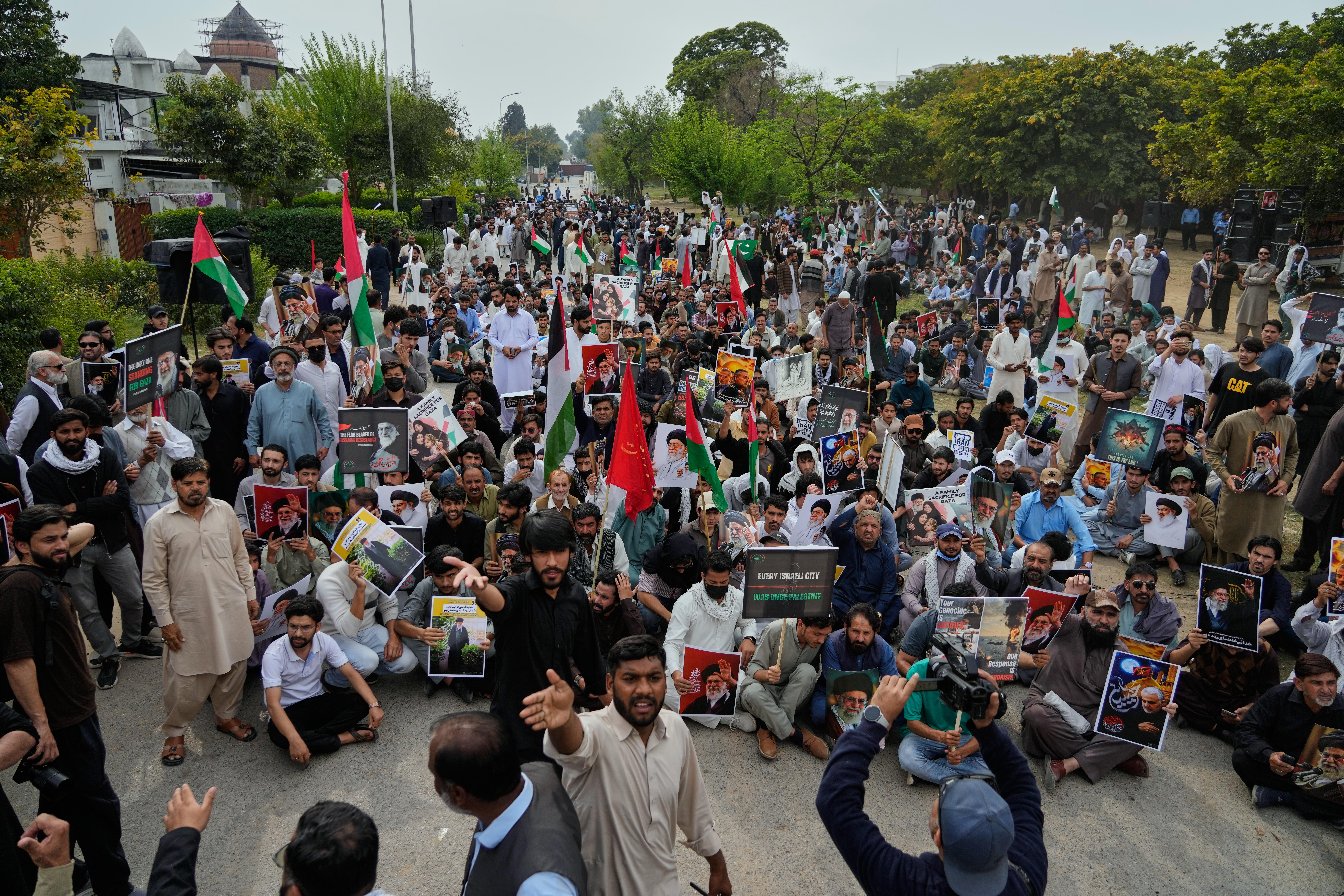 Shiite Muslims take part in a rally to condemn the killing of Iranian Supreme Leader Ayatollah Ali Khamenei.