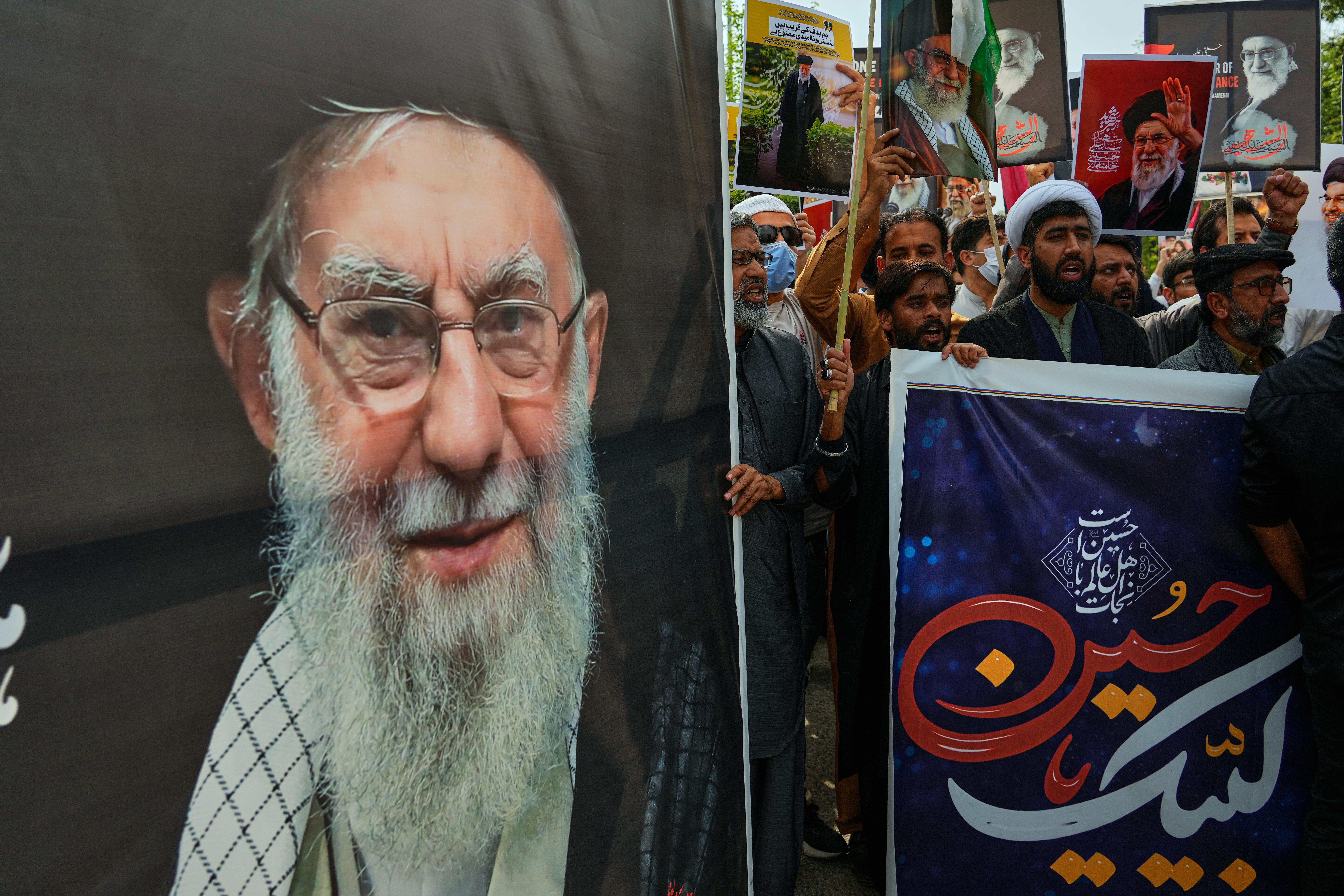Shiite Muslims take part in a rally to condemn the killing of Iranian Supreme Leader Ayatollah Ali Khamenei.