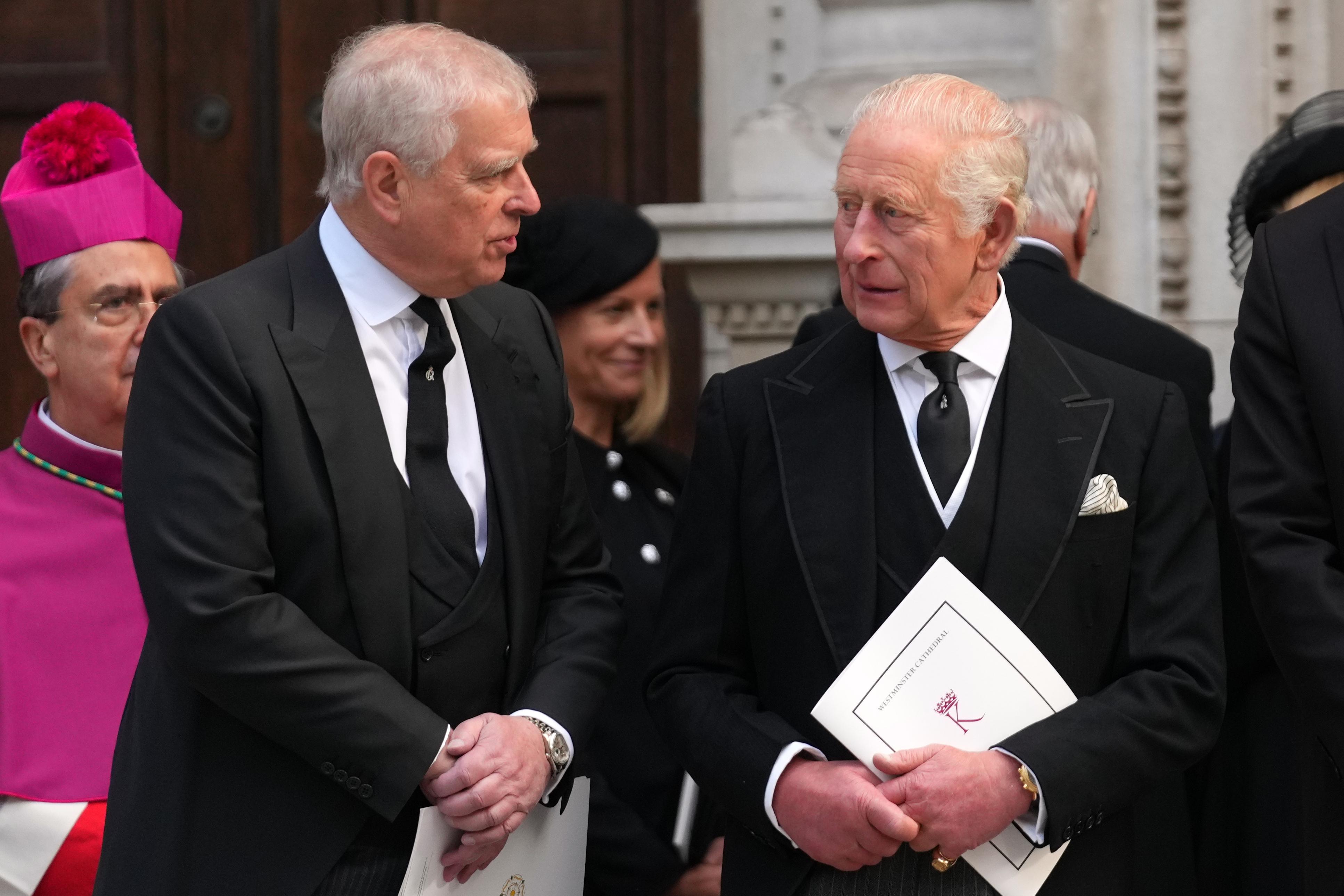 FILE – Britain’s Prince Andrew, left, and Britain’s King Charles...