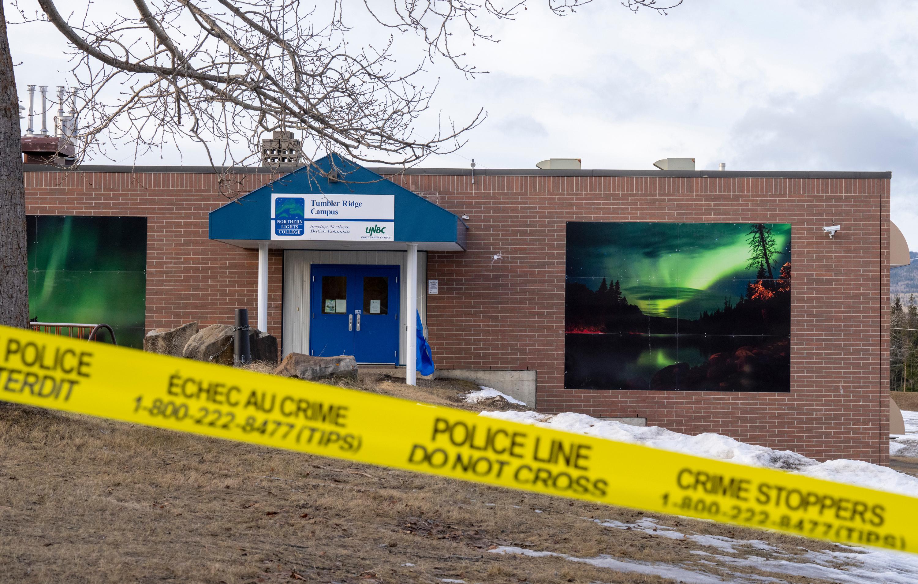 Police tape surrounds a school in Tumbler Ridge, British Columbia,...