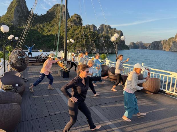 Morning tai chi as we cruised Bai Tu Long Bay on our private boat. (Lori Rackl/Lori Rackl/TNS)