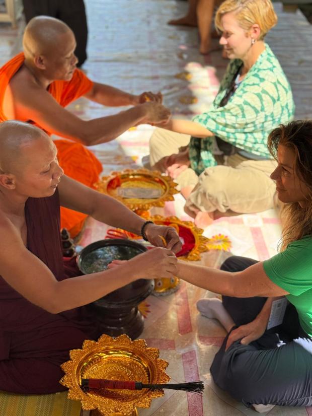 Buddhist monks in Cambodia gave our group a water blessing that culminated with tying string bracelets around our wrists. (Lori Rackl/Lori Rackl/TNS)