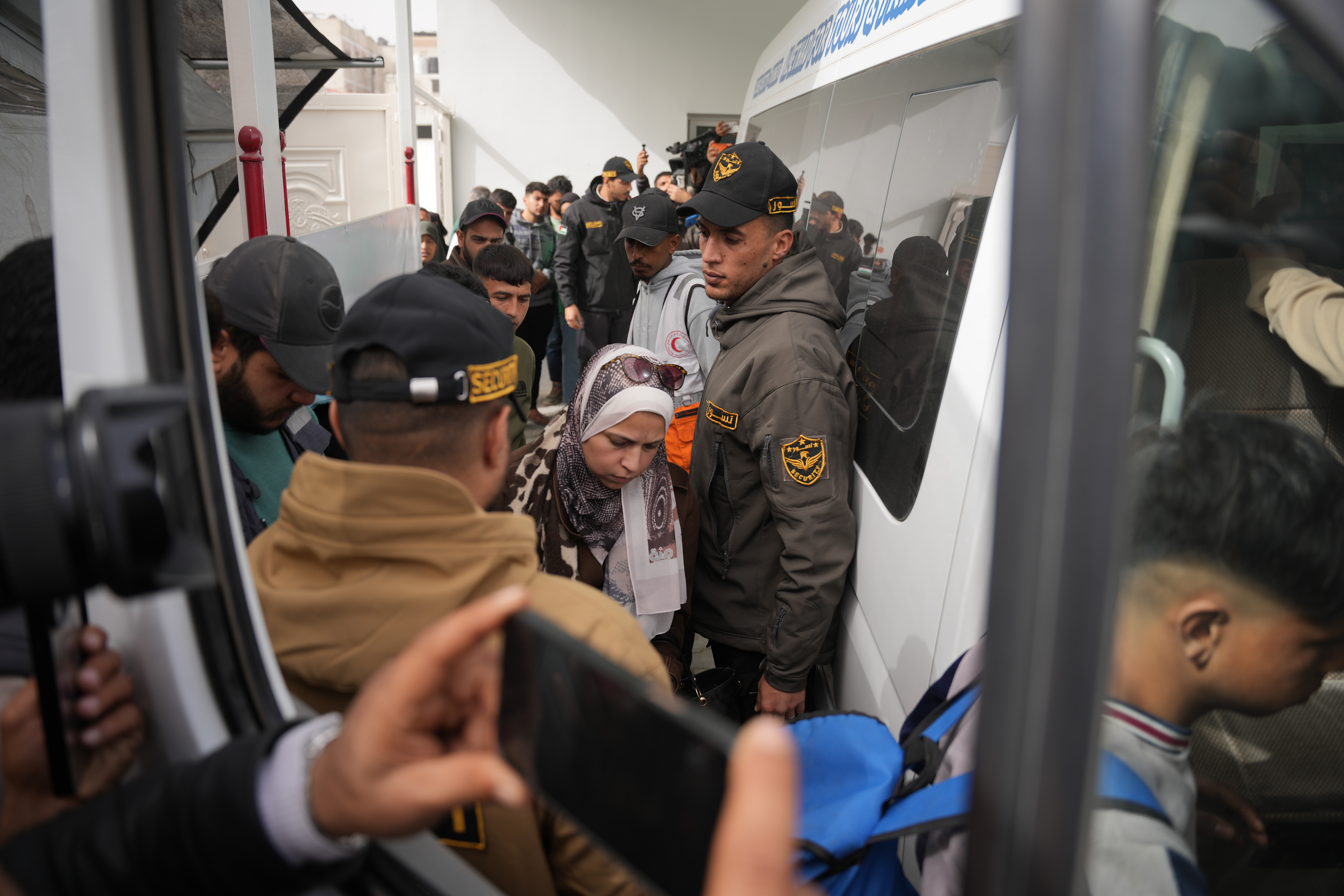 Palestinian patients board a vehicle in Khan Younis on their...