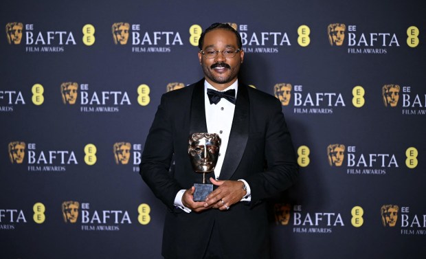 US film director Ryan Coogler poses with the award for Best orignal screenplay for "Sinners" during the BAFTA British Academy Film Awards ceremony at the Royal Festival Hall, Southbank Centre, in London, on February 22, 2026. (Photo by JUSTIN TALLIS / AFP via Getty Images)