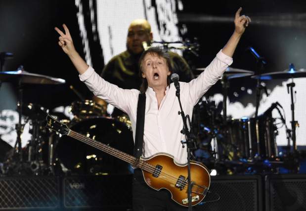 Paul McCartney's "Man on the Run" documentary will screen in select theaters before arriving worldwide on streaming beginning Feb. 25.(Photo by Chris Pizzello/Invision/AP)