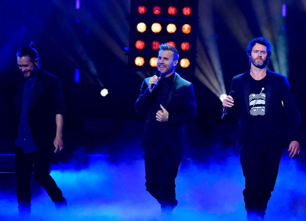 Take That members Mark Owen, Gary Barlow and Howard Donald perform on stage during the Bambi Awards ceremony on November 16, 2018, at the Stage Theatre on Potsdamer Platz in Berlin. Take That will be the focus of a Netflix Documentary series scheduled for release on Jan. 27. (Photo by Tobias Schwarz, Getty Images)