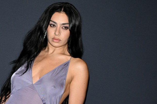 Charli XCX's "The Moment" documentary will arrive in theaters worldwide in late January.(Photo by Bertrand GUAY / AFP) (Photo by BERTRAND GUAY/AFP via Getty Images)