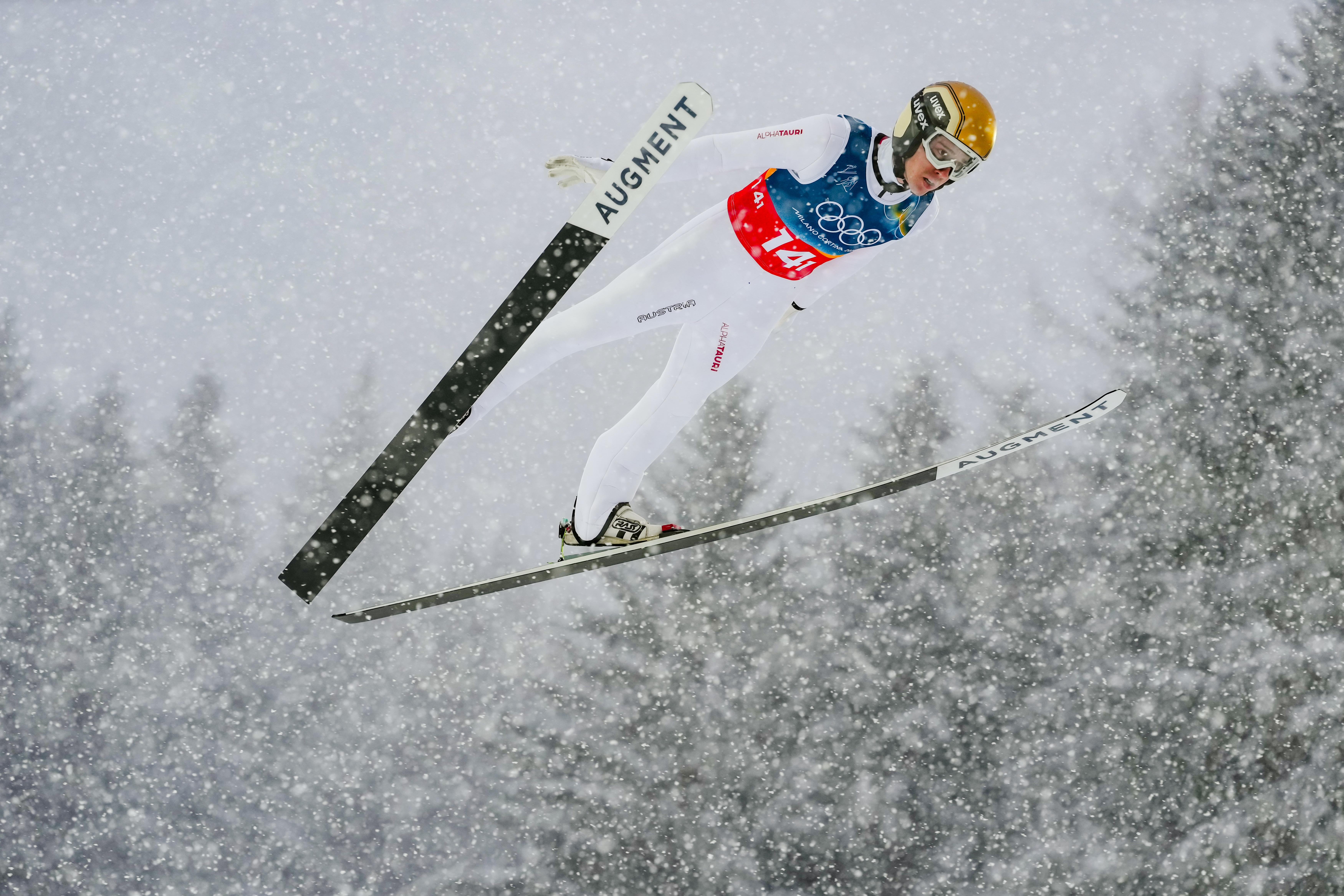 Stefan Rettenegger, of Austria, soars through the air during the...