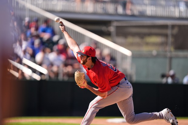 Boston Red Sox pitcher Justin Slaten delivers in the fourth inning of a spring training game against the Minnesota Twins in Fort Myers, Fla., Wednesday, Feb. 25, 2026. (AP Photo/Gerald Herbert)