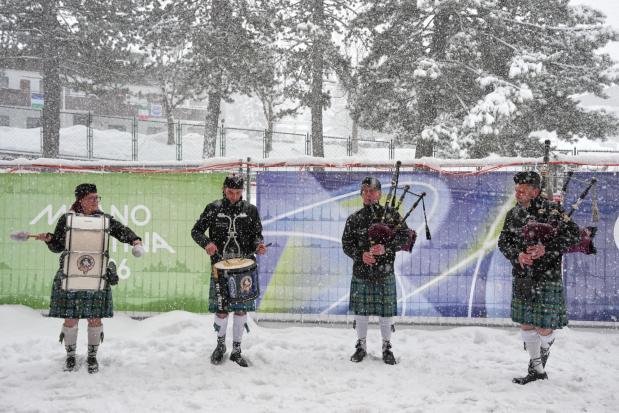 Italian bagpipers practice outside the curling stadium at the 2026 Winter Olympics, in Cortina d'Ampezzo, Italy, Thursday, Feb. 19, 2026. (AP Photo/Misper Apawu)