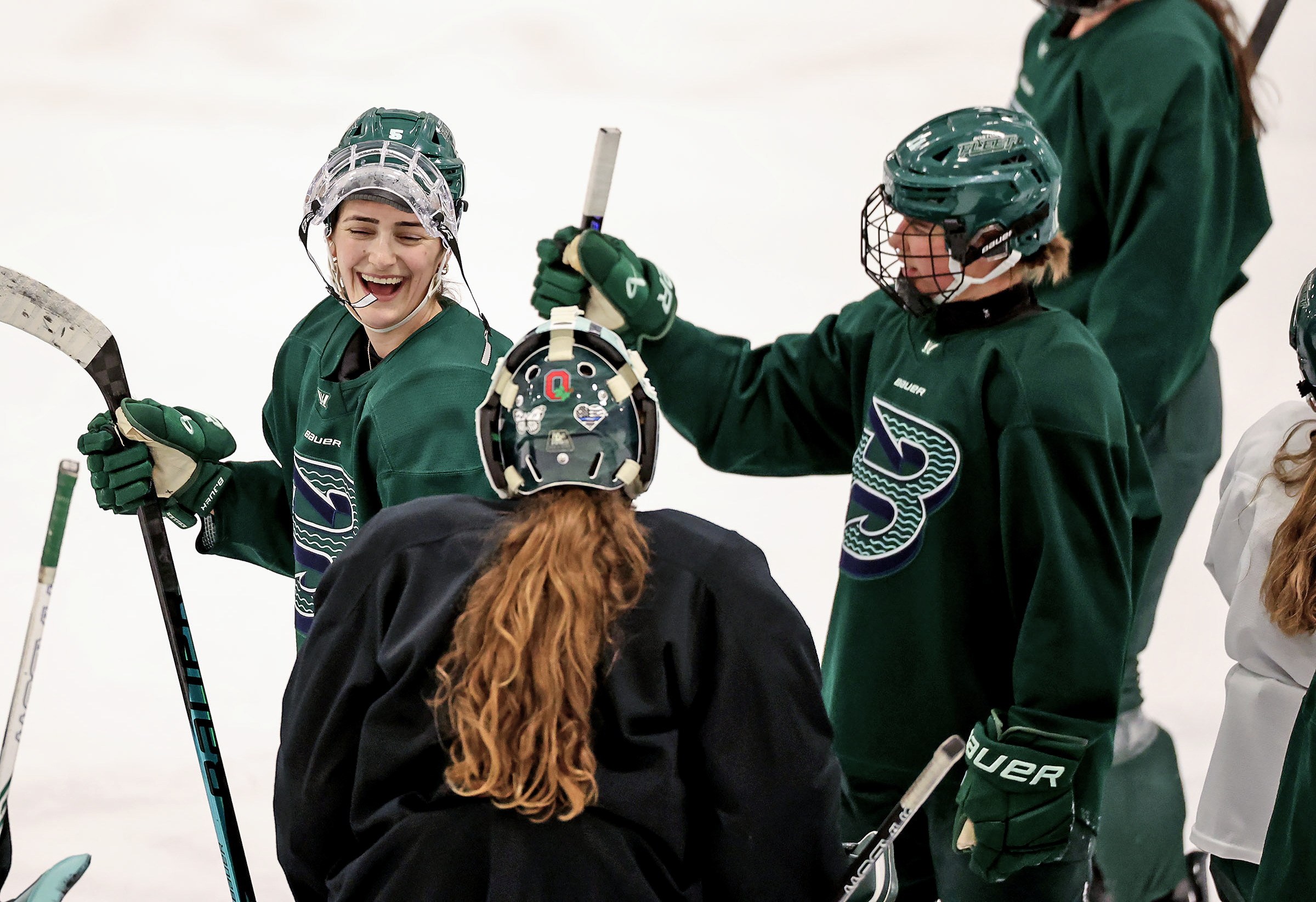 Boston Fleetâs Megan Keller, left, laughs with teammate at the...