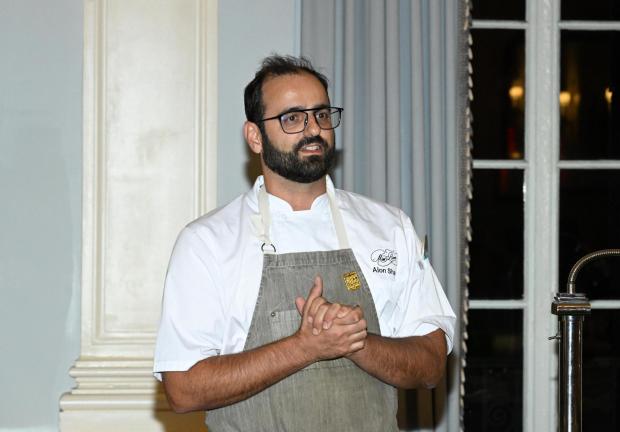 Chef Alon Shaya speeks to guests during Dinner with Alon Shaya and Andrew Zimmern presented by Boisson during Food Network New York City Wine& Food Festival presented by Capital One on Oct. 15, 2022, in New York City. (Slaven Vlasic/Getty Images North America/TNS)