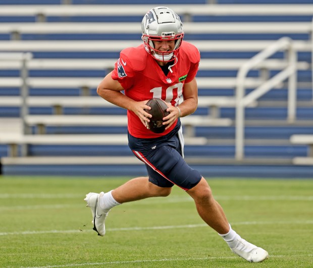 New England Patriots rookie quarterback Drake Maye runs a drill during practice at Gillette Stadium on Wednesday. (Photo By Matt Stone/Boston Herald)