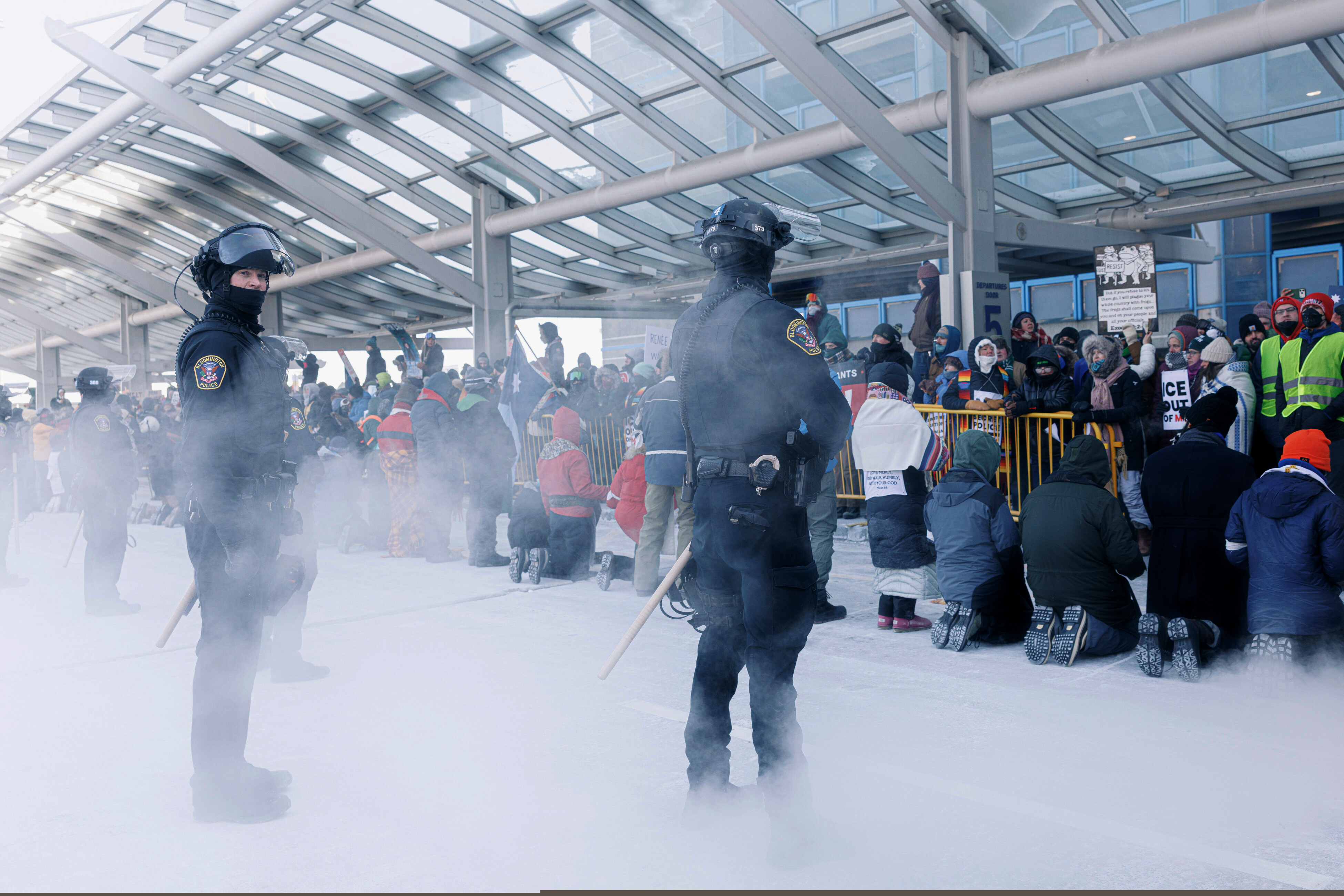 Clergy members and community activists gather at the Minneapolis-St. Paul International Airport, to protest deportation flights