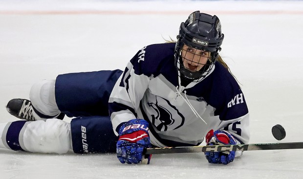 St. Mary's skater Emma Doucette goes down with the puck during a girls hockey game against Malden Catholic. (Photo By Matt Stone/Boston Herald)