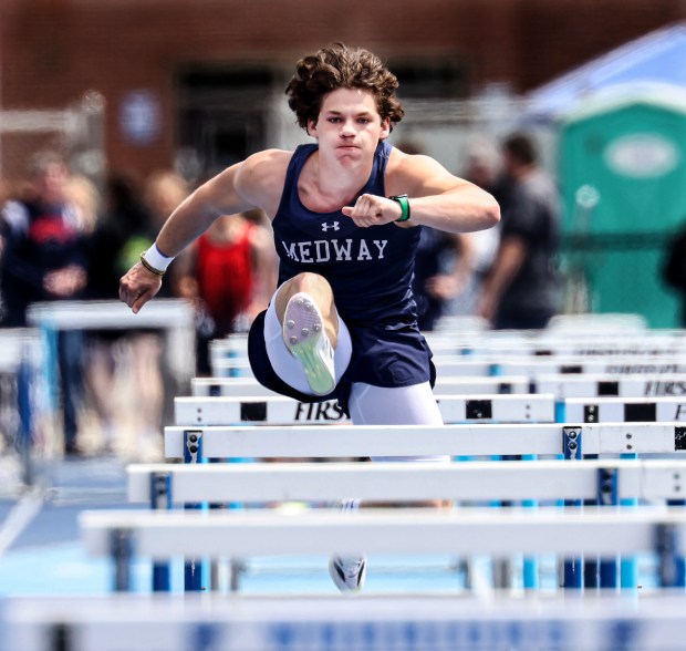 Dalton Feeney of Medway competes in the shuttle hurdles during the Division 5 relays in Seekonk. (Photo by Mark Stockwell/Boston Herald)