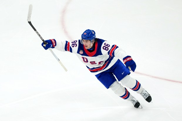 United States' Jack Hughes celebrates after scoring the winning goal against Canada during the overtime period of the men's ice hockey gold medal game at the 2026 Winter Olympics in Milan, Italy, Sunday, Feb. 22, 2026. (AP Photo/Carolyn Kaster)