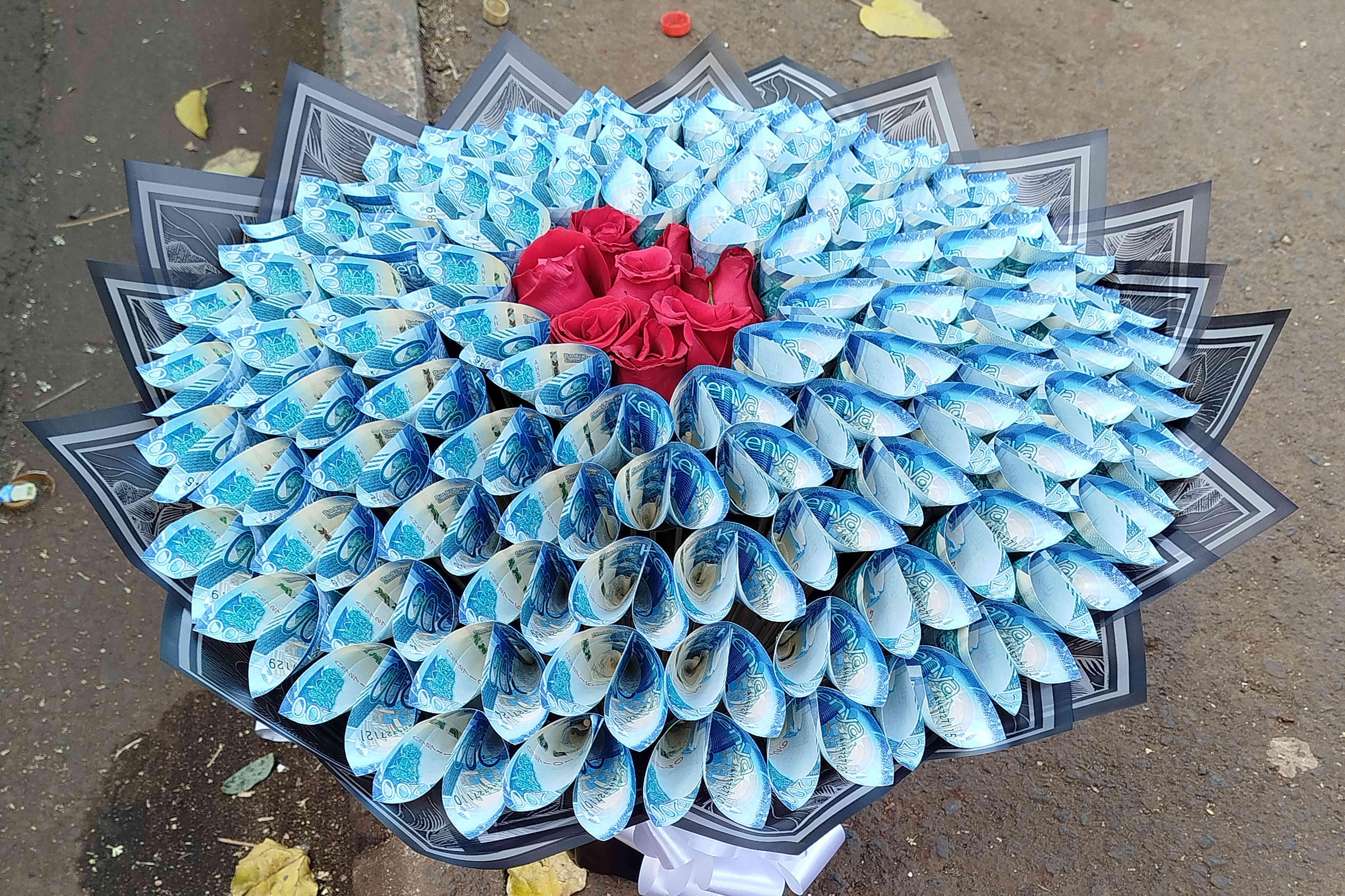 A flower bouquet that incorporates real money sits for sale...