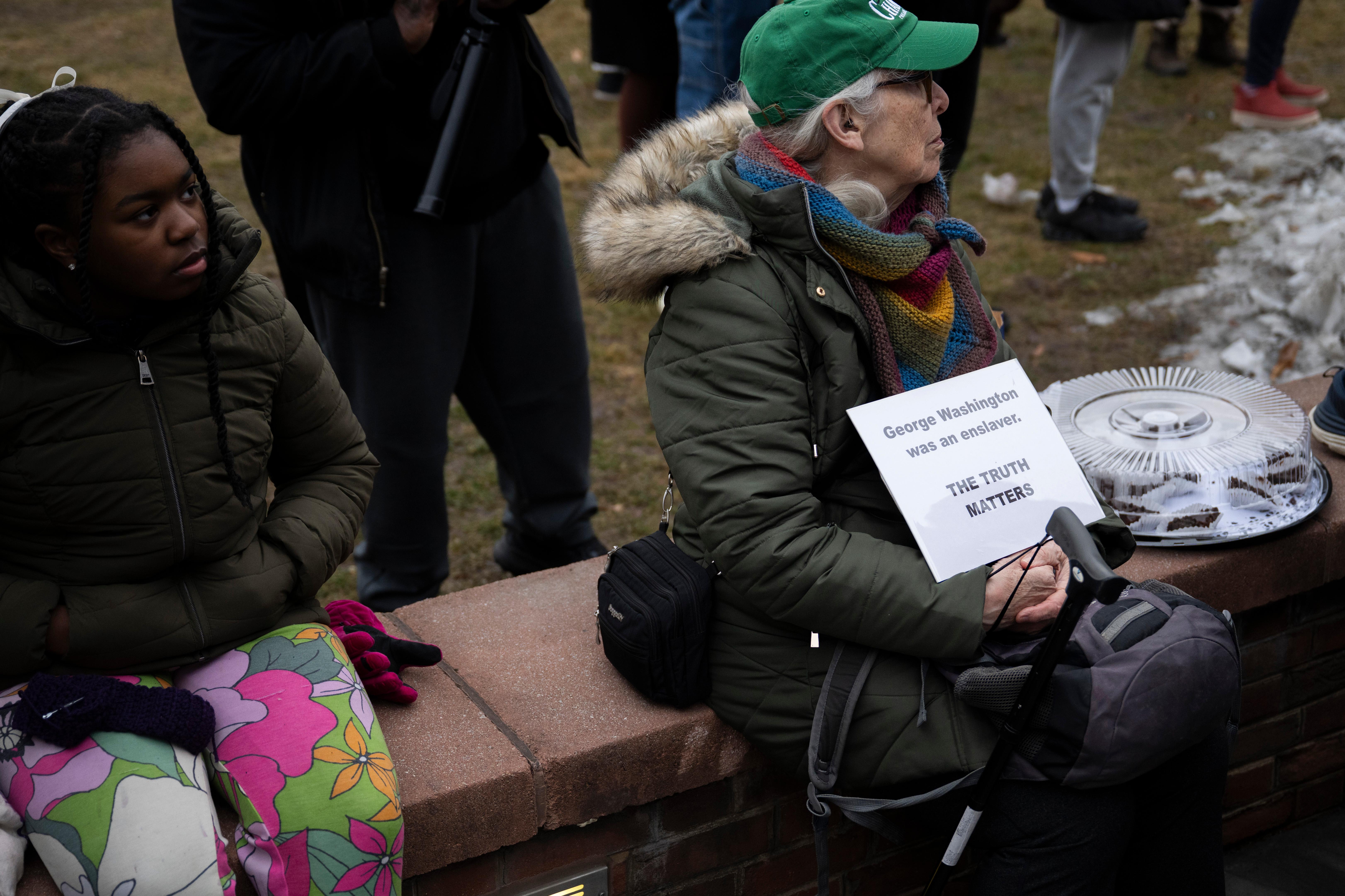 Attendees gather for a rally celebrating the reinstallation of a...