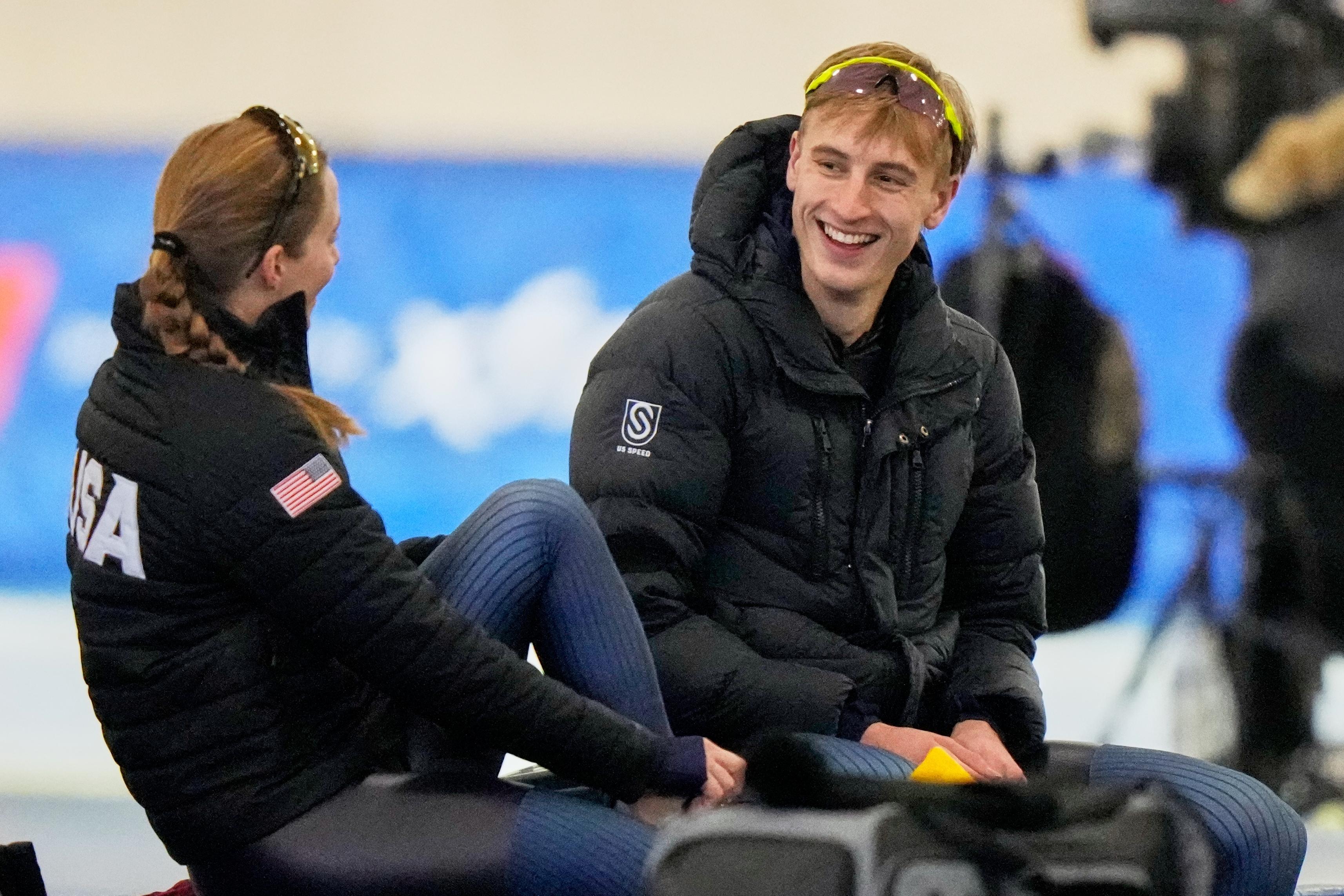 Speedskater Jordan Stolz talks to speedskater Rebecca Simmons at the...
