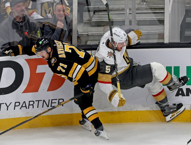 Boston Bruins left wing Viktor Arvidsson (71) and Vegas Golden Knights defenseman Jeremy Lauzon collide during the first period at the TD Garden. (Photo By Matt Stone/Boston Herald)