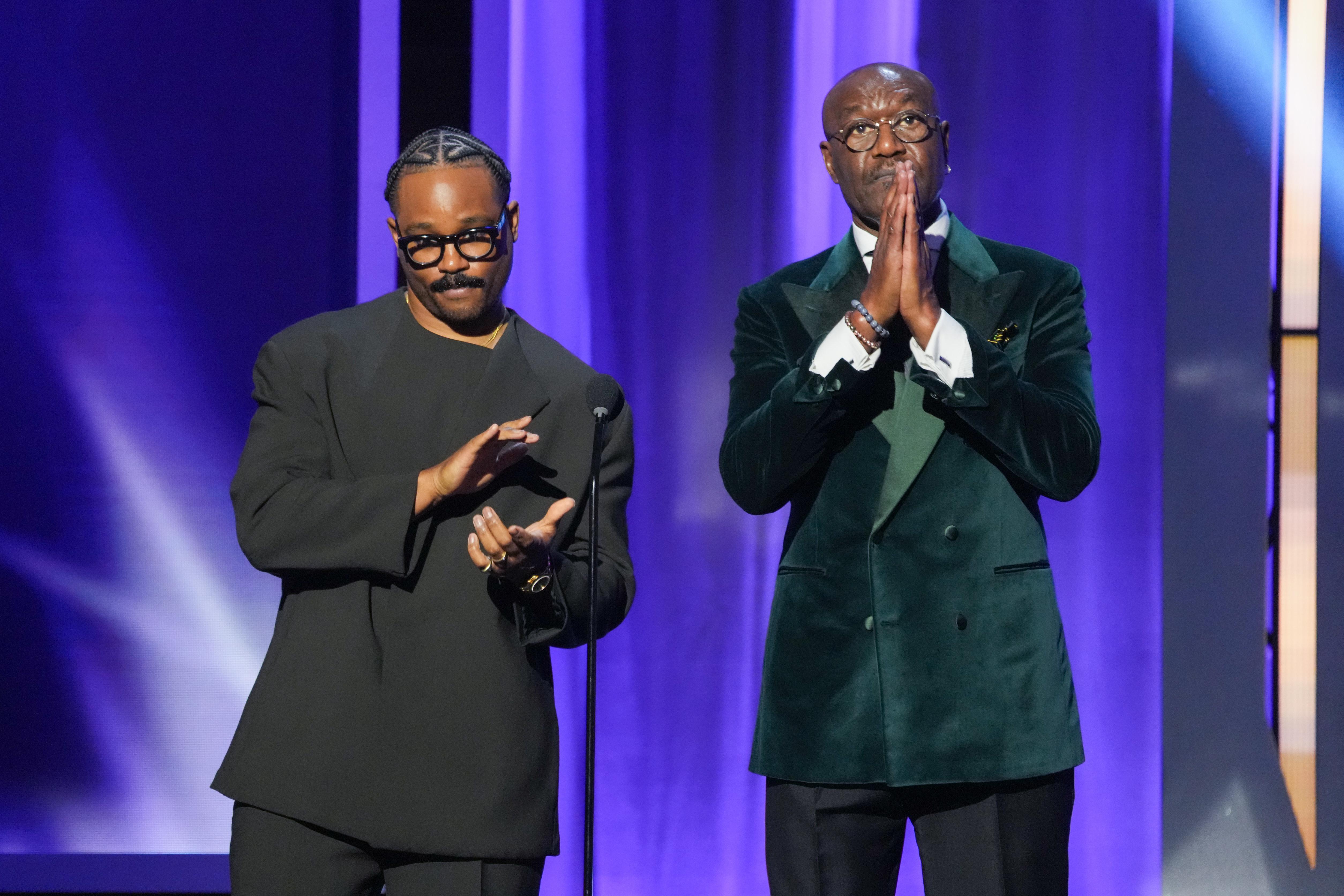 Ryan Coogler, left, and Delroy Lindo present the award for...