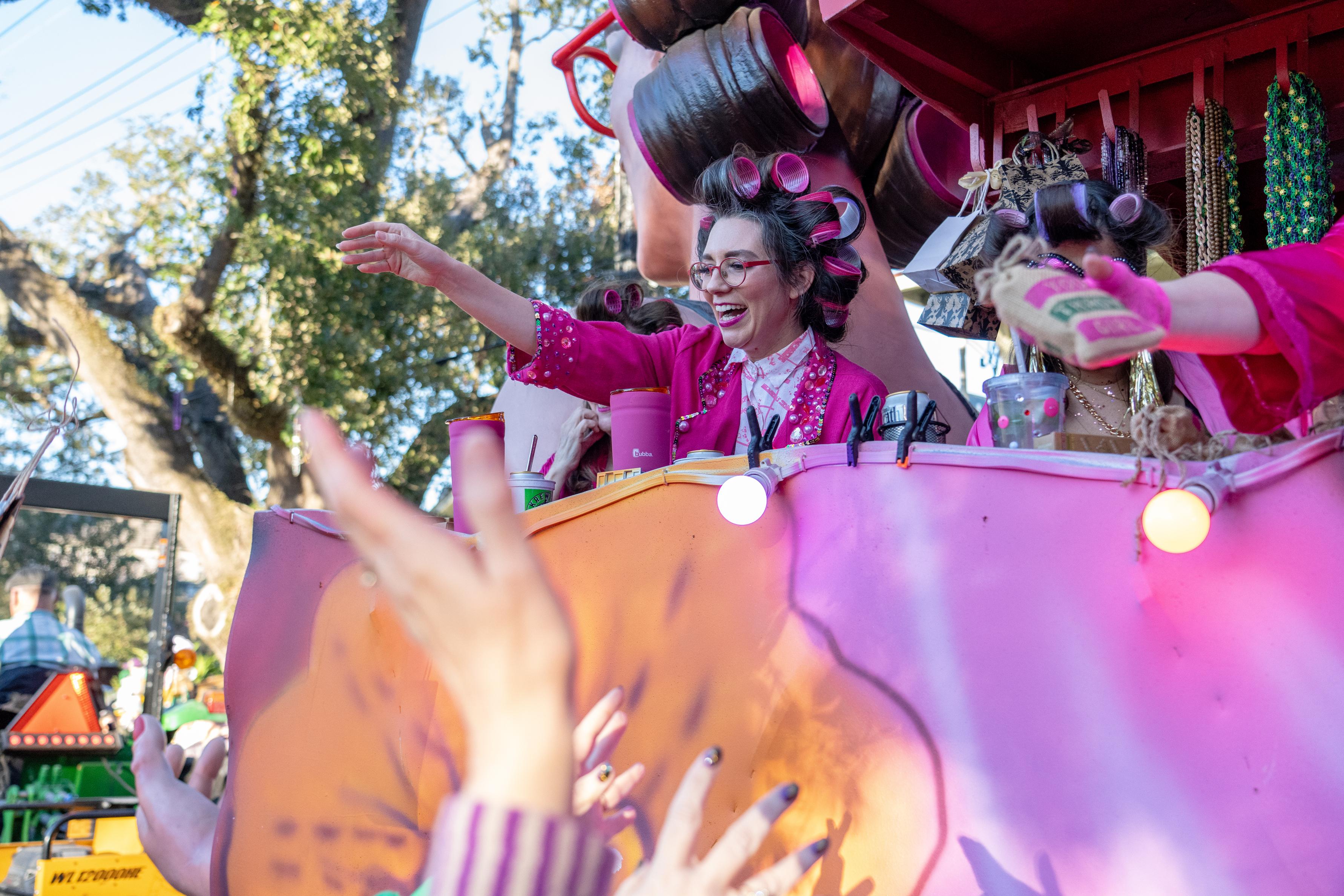 Boyfriend on her float takes part in the annual Krewe...