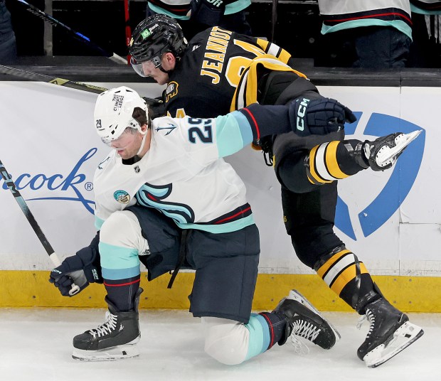 Seattle Kraken defenseman Vince Dunn (29) and Boston Bruins left wing Tanner Jeannot (84) collide during the second period of a NHL game at the Garden. (Photo By Matt Stone/Boston Herald)