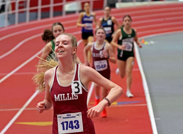 Emma Genovese, of Millis High, wins the girls mile at the Div. 5 indoor track championships. (Staff photo by Stuart Cahill)