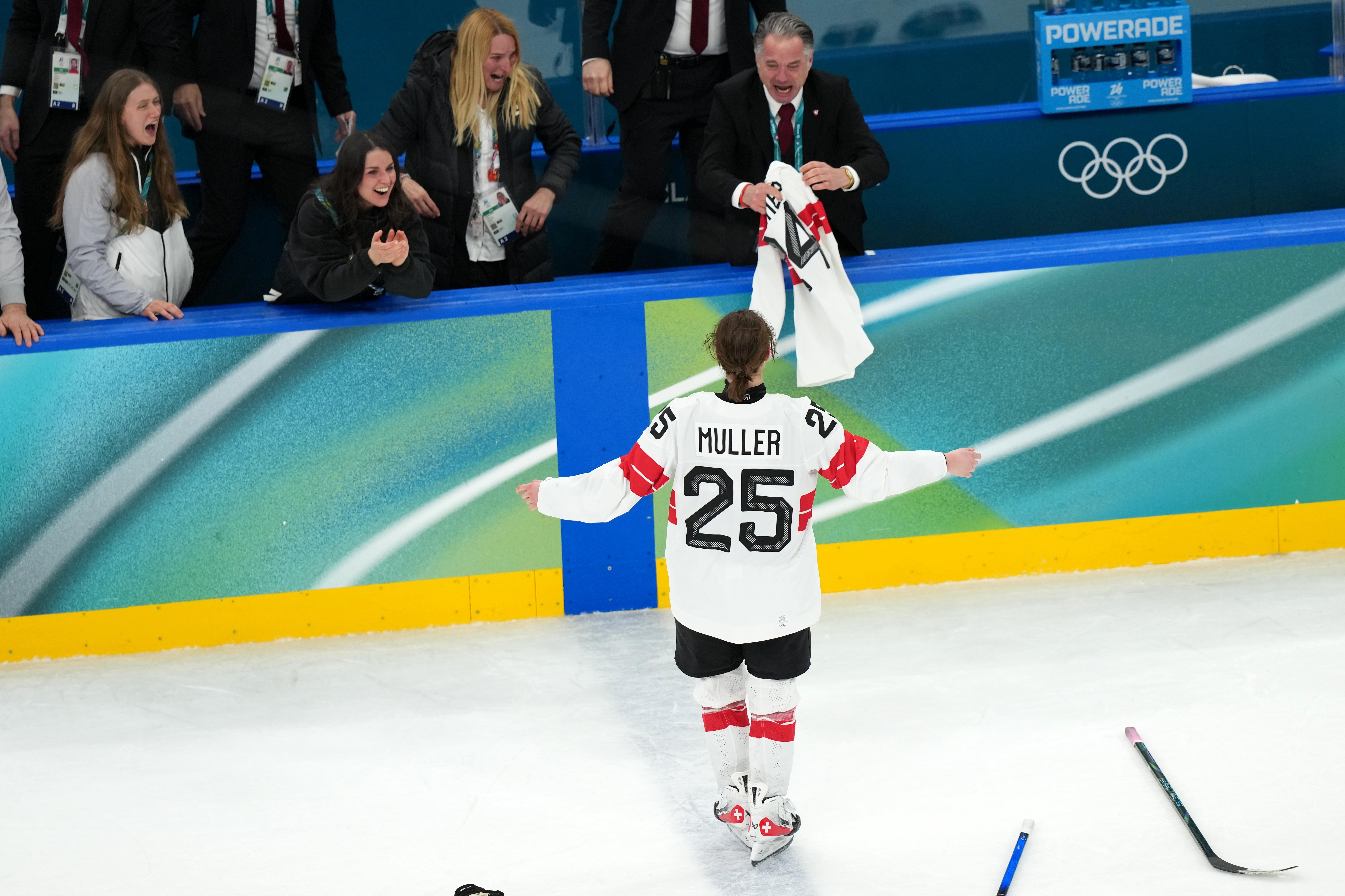 Alina Muller celebrates after scoring the winning goal in overtime to beat Sweden in the women's ice hockey bronze medal game.
