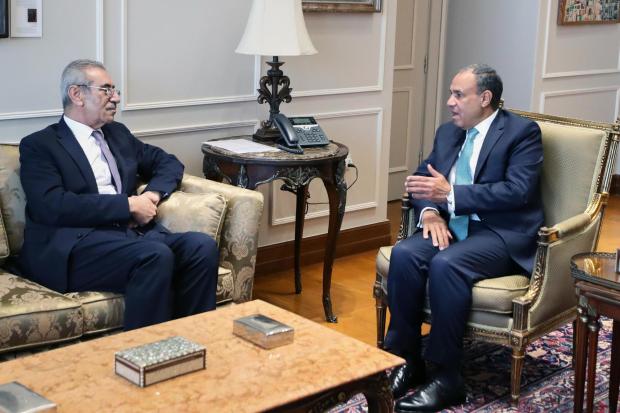 Ali Shaath, head of Palestinian National committee for administering the Gaza Strip, left, meets with Egyptian Foreign Minister Badr Abdelatty