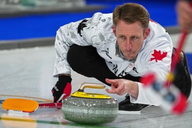 Canada's Marc Kennedy in action during the men's curling round robin session against China, at the 2026 Winter Olympics, in Cortina d'Ampezzo, Italy, Sunday, Feb. 15, 2026. (AP Photo/Misper Apawu)