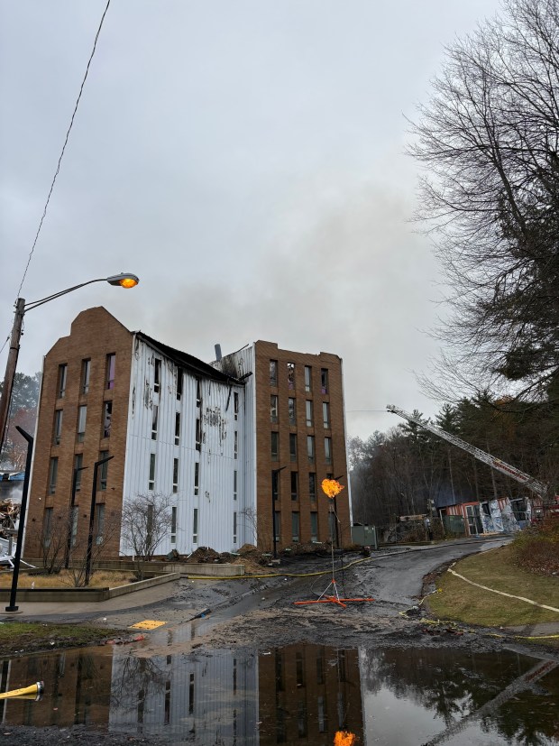 Fire crews worked to extinguish the blaze at 57 Olympia Dr. in Amherst on Sunday. (Isabelle Friedman/Boston Herald)