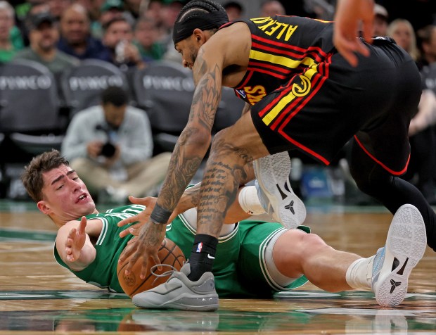 Atlanta Hawks guard Nickeil Alexander-Walker (7) takes the ball from Boston Celtics center Luka Garza during the second half of an NBA game at the TD Garden. (Photo By Matt Stone/Boston Herald)