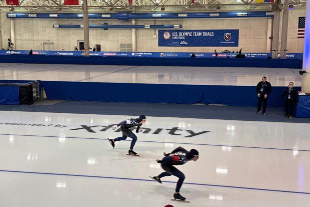 Casey Dawson, of Park City, Utah, right, and Ethan Cepuran, of Glen Ellyn, lllinois, left, compete in the men's 5,000 meters at the U.S. Olympic trials for long track speed skating at the Pettit National Ice Center in Milwaukee, Friday, Jan. 2, 2026. (AP Photo/Howard Fendrich)
