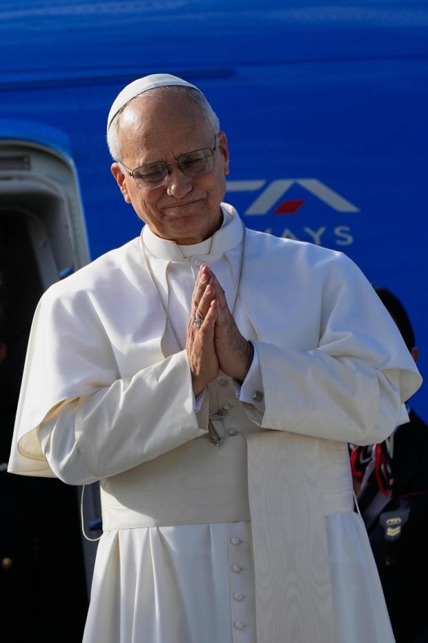Pope Leo XIV gestures as he boards a flight back to the Vatican after his visit to Lebanon at Beirut International Airport in Beirut, Lebanon, Tuesday, Dec. 2, 2025. (AP Photo/Hussein Malla)