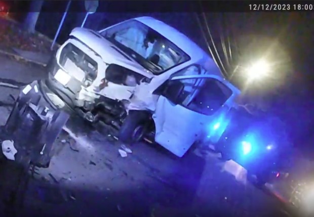 The smashed van at the Woburn crash scene. (MSP body camera video screengrab)