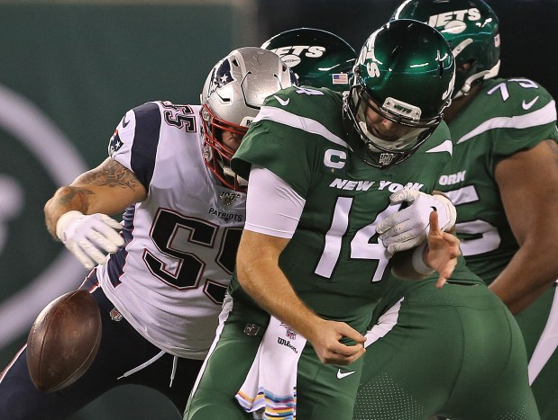 EAST RUTHERFORD, NJ. - OCTOBER 21: Sam Darnold #14 of the New York Jets looses the ball as he gets sacked by John Simon #55 of the New England Patriots during the second quarter of the NFL game at MetLife Stadium on October 21, 2019 in East Rutherford, New Jersey. (Staff Photo By Matt Stone/MediaNews Group/Boston Herald)