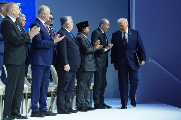 President Donald Trump arrives for a Board of Peace charter announcement during the Annual Meeting of the World Economic Forum in Davos