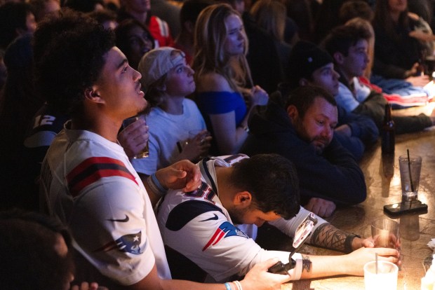 Disappointment sets in for fans at the Cask 'N Flagon. (Libby O'Neill/Boston Herald)