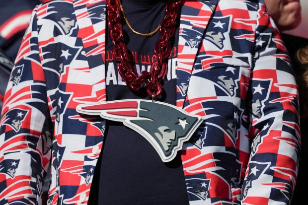A fan wears Patriots colors before the start of Super Bowl LX in Santa Clara, Calif. (AP Photo/Matt Slocum)