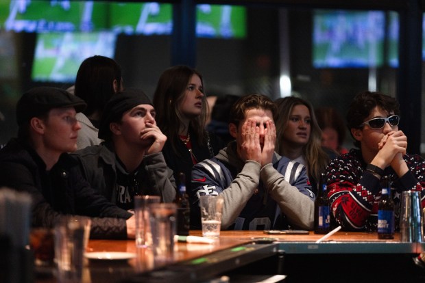 There were long faces at the bar at the Cask 'N Flagon as fans watched the Patriots in Super Bowl LX. (Libby O'Neill/Boston Herald)