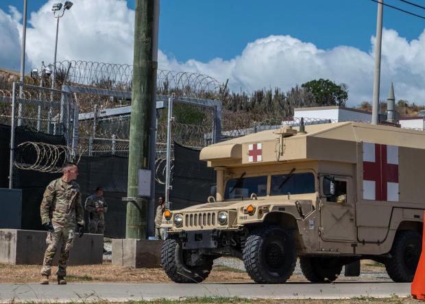 U.S. service members stand by during an April 2025 simulated medical evacuation of immigrants detained at Guantánamo. (Aubree Owens/U.S. Air Force/U.S. Air Force/TNS)