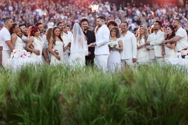 A couple gets married during the Bad Bunny performance onstage during the Apple Music Super Bowl LX Halftime Show at Levi's Stadium on February 08, 2026 in Santa Clara, California. 