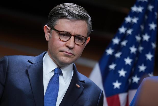 Speaker of the House Mike Johnson pauses before taking questions at a news conference.