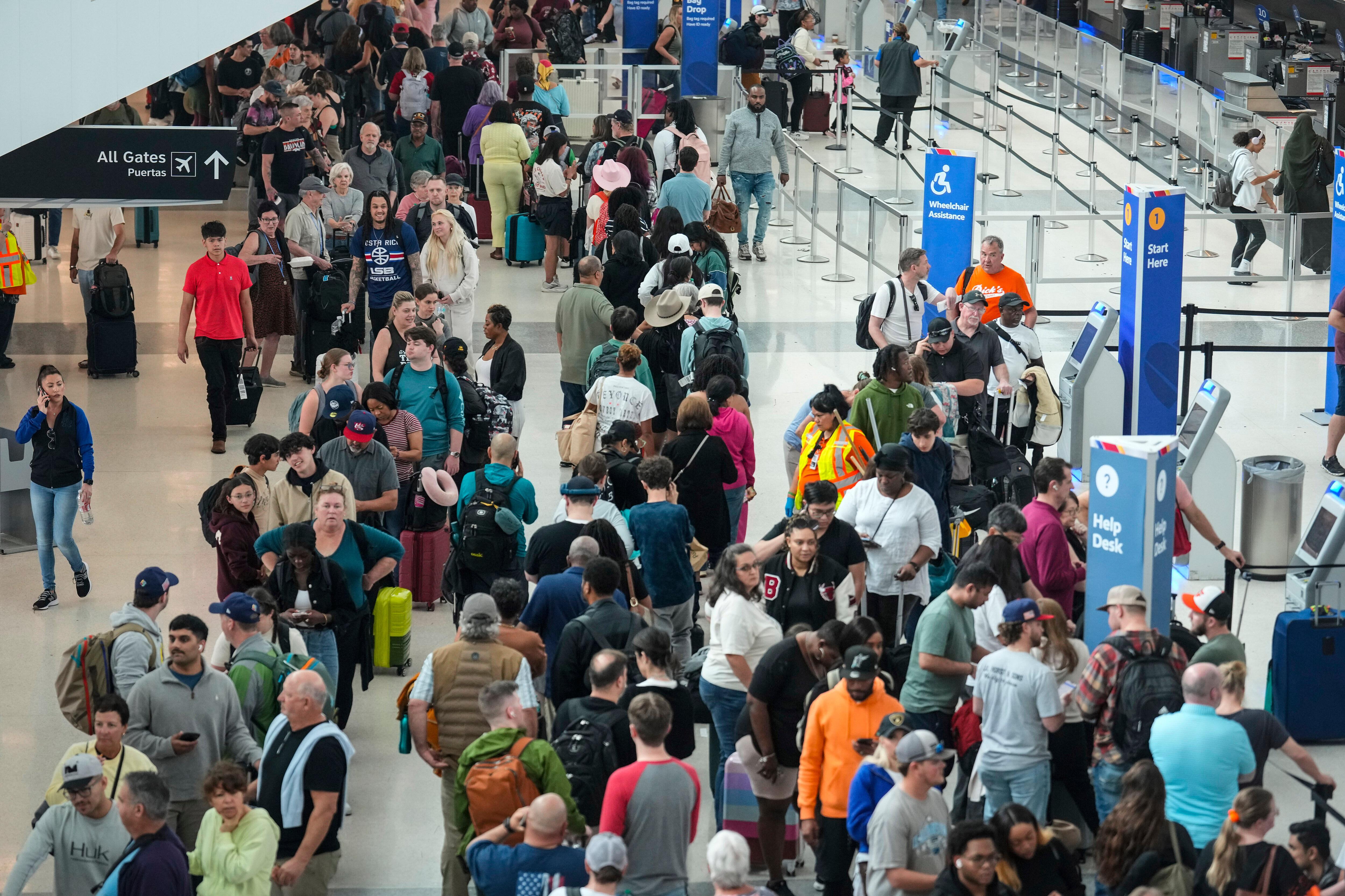 Airline passengers wait in long lines to get through TSA screening in Houston.