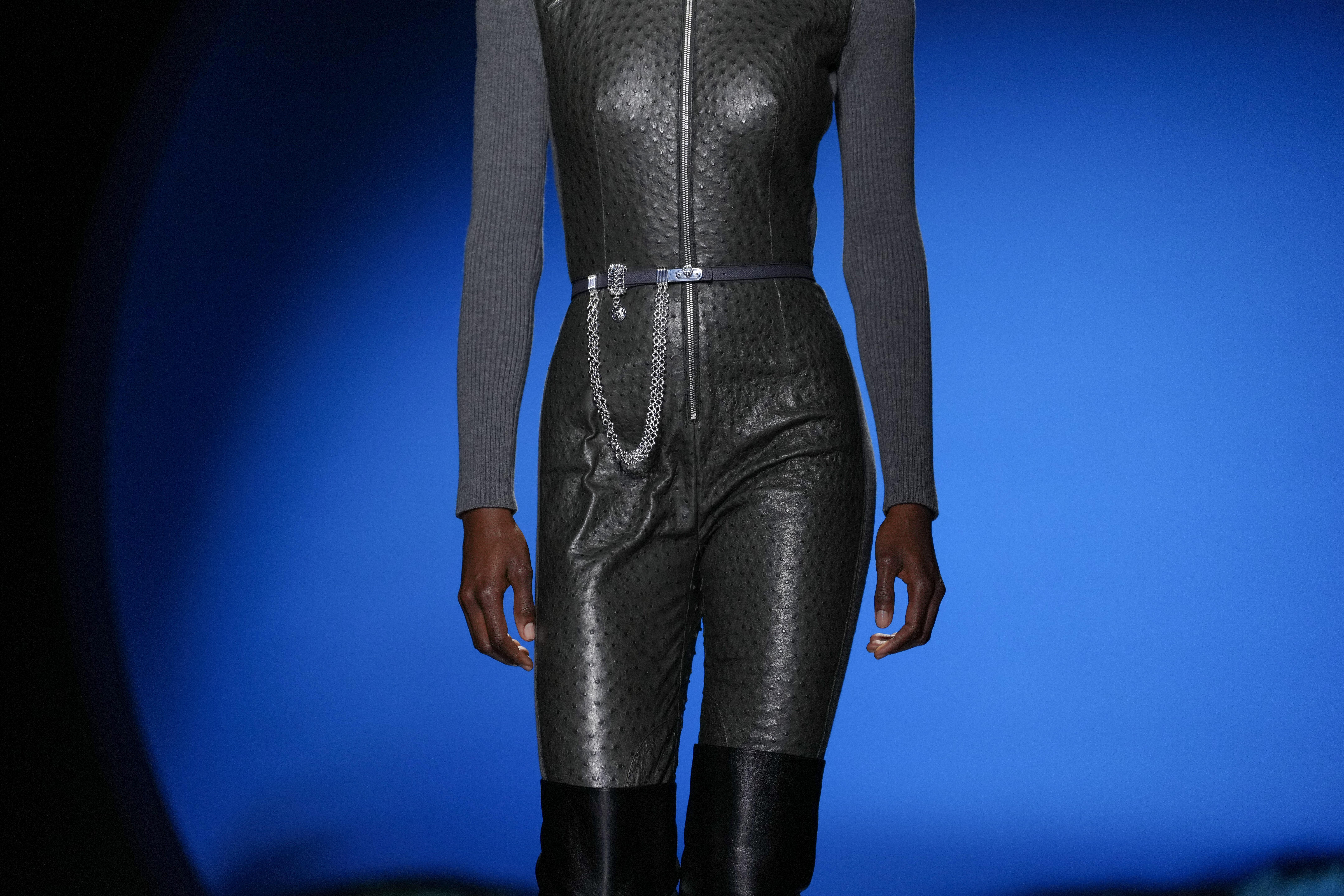 A model wears a creation as part of the Hermes...