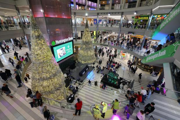 Shoppers browse through stores at Mall of America for Black Friday deals, Friday, Nov. 28, 2025, in Bloomington, Minn. (AP Photo/Adam Bettcher)